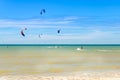 Multiple sports man flying on their kite boarding