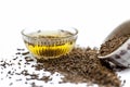 Cumin extract in a glass bowl isolated along with raw cumin or zeera. Royalty Free Stock Photo
