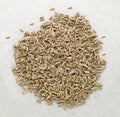 Cumin seed of background photographics, Pile of cumin seeds isolated on white background, top view