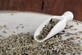 Cumin seed and wooden scoop on board Cuminum cyminum Royalty Free Stock Photo