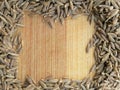 Cumin seeds frame on wooden background Royalty Free Stock Photo