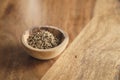 Cumin zira seeds in wood bowl on table Royalty Free Stock Photo