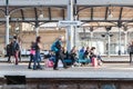 Cummuters and travellers waiting for a train on a platform of Newcastle Central Railways Station