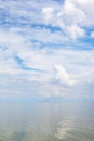 Cumuli white clouds and calm water Sea of Azov