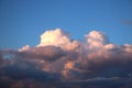 Cumulo-nimbus clouds pink at sunset and blue sky