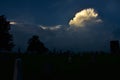 Cumulonimbus cloud building over the cemetery