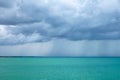 Cumulonimbus clouds over the turquoise sea Royalty Free Stock Photo