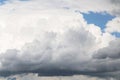 Cumulus big white clouds in sunlight against blue sky background, heaven Royalty Free Stock Photo