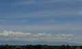 Cumulus cirrus clouds hawk in flight hazy day Idaho