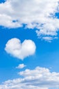 cumulus clouds on blue sky with heart shaped cloud. vertical frame Royalty Free Stock Photo