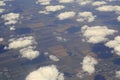 Cumulus clouds over the fields from airplane view