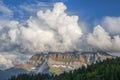 Cumulus clouds over mountain peaks in the Swiss Alps Royalty Free Stock Photo