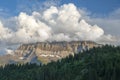 Cumulus clouds over mountain peaks in the Swiss Alps Royalty Free Stock Photo