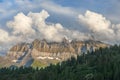 Cumulus clouds over mountain peaks in the Swiss Alps Royalty Free Stock Photo