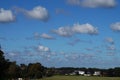 Cumulus clouds in the sky over the countryside in autumn Royalty Free Stock Photo