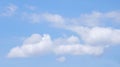 Cumulus Clouds Spread By The Wind On The Horizon