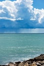 Cumulus Clouds and Torrential Rain on the Horizon over the Sea Royalty Free Stock Photo