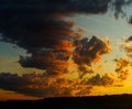 cumulus and cumulonimbus clouds at sunset