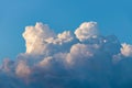 Cumulus sunset clouds with sun setting down