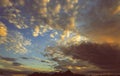 Cumulus sunset clouds with sun setting down Dramatic Sunset sky Toned Image Royalty Free Stock Photo