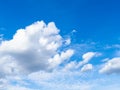 Cumulus white clouds in blue sky in July