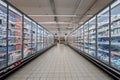 Refrigerator showcases display dairy products in italian supermarket