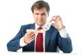 Cunning businessman taking dollar bill out of mousetrap