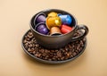 Cup with aluminium coffee capsules pods with fresh aroma coffee on beige background Royalty Free Stock Photo