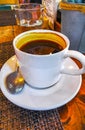 Cup of americano black coffee and glass of water cafe