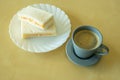 A Cup of Americano Black Coffee and Ham With Egg Sandwich on The Wooden Table