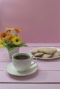 Cup of Americano coffee and homemade pastries on pink background. Coffee time, romance Royalty Free Stock Photo