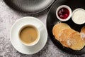 Cup of americano coffee with pancakes cake for breakfast. A cup of black coffee in a white cup, shot from above, with Royalty Free Stock Photo
