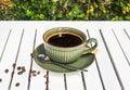 Cup of Americano with spoon and sugar on wooden white table side view Royalty Free Stock Photo