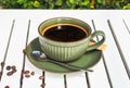 Cup of Americano with spoon and sugar on wooden white table side view Royalty Free Stock Photo