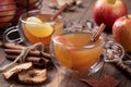 Cup of apple cider with cinnimon stick and sliced apple Royalty Free Stock Photo