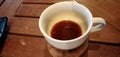 A cup of arabican coffee on the wooden table