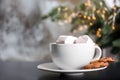 Cup of aromatic cacao with marshmallows and cookies on table, closeup