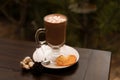 Cup of aromatic cacao on table