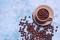 Cup of Aromatic Coffee with Grains on Light Blue Background. Top View Flat Lay. Copy Space For Your Text Royalty Free Stock Photo