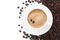 Cup with aromatic coffee and pile of beans on white background, top view Royalty Free Stock Photo