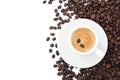 Cup with aromatic coffee and pile of beans on white background, top view Royalty Free Stock Photo