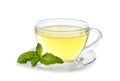 Cup with aromatic mint tea on white background