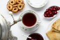 Cup of aromatic tea and treats on table, flat lay Royalty Free Stock Photo