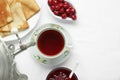 Cup of aromatic tea and treats on table, flat lay. Space for text Royalty Free Stock Photo