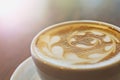 Cup of art latte or cappuccino coffee with retro Royalty Free Stock Photo