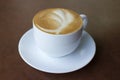 Cup of art latte on a cappuccino coffee Royalty Free Stock Photo