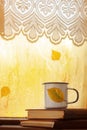 Cup of autumn tea, coffee, chocolate and yellow leaves on rainy window, copy space. Hot drink for autumn mood. Royalty Free Stock Photo