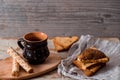 Cup of autumn tea with note book and yellow dry leaves near a window, copy space. Hot drink for autumn cold rainy days. Hygge Royalty Free Stock Photo