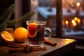 Cup of autumn or winter mulled wine or gluhwein with spices and orange slices