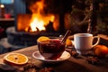 Cup of autumn or winter mulled wine or gluhwein with spices and orange slices